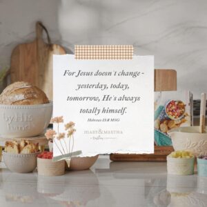 “A serene image of a quote on a piece of paper, surrounded by various items including food and flowers.”